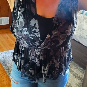 Express Peplum Black Mesh Top with floral print.